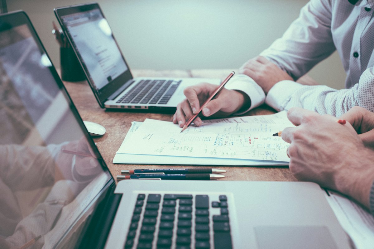 Consultant reviewing documents at a desk